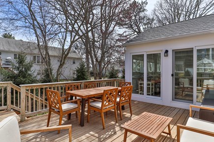 Yarmouth Port Cape Cod vacation rental - Sunporch slider leads out to large deck great for outdoor dining.