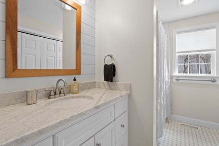 Yarmouth Port Cape Cod vacation rental - Shared bathroom with tile shower / tub combo.