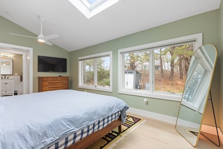Provincetown Cape Cod vacation rental - Cozy king bed, full length mirror, and a 60 inch wall mounted TV
