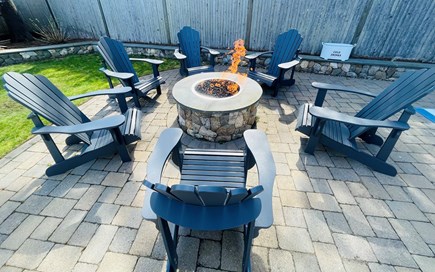 Harwichport Cape Cod vacation rental - Backyard gas firepit. 6 Adirondack chairs.