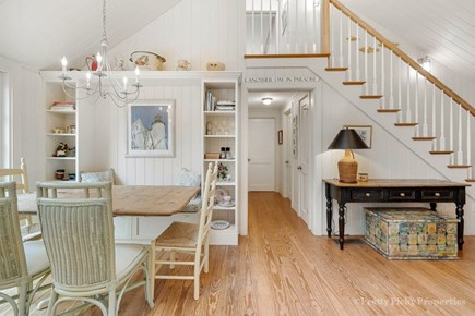 Brewster Cape Cod vacation rental - Dining area.  Open staircase and vaulted ceiling with skylights contribute to the feeling of space and light.
