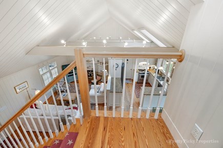 Brewster Cape Cod vacation rental - Top of the staircase provides an appealing view of the home's central living space below.