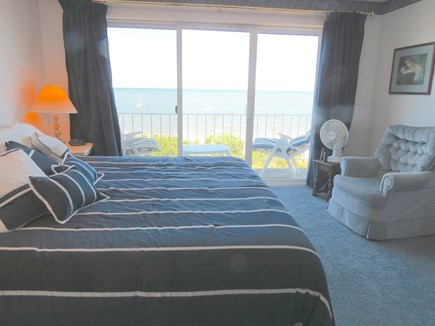Brewster Cape Cod vacation rental - Second level, primary bedroom with king size bed and balcony deck