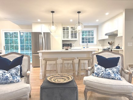 Harwich Cape Cod vacation rental - Modern and open kitchen, dining, living room setup.