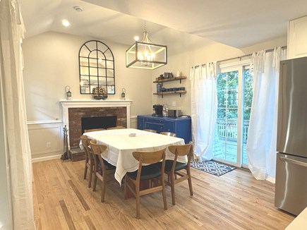 Harwich Cape Cod vacation rental - Dining area with seating for 8, coffee corner, and exit to deck.