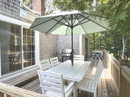 Harwich Cape Cod vacation rental - Deck with Weber grill and shaded seating for outdoor meals.