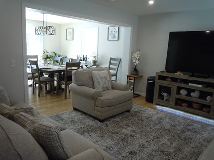 Barnstable  Cape Cod vacation rental - Living room off foyer entrance 2 sofa's open to kit/dining area.