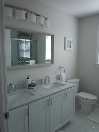 Barnstable  Cape Cod vacation rental - Master bathroom with double sinks & shower.