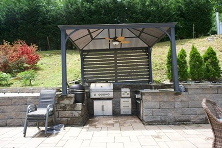 East Sandwich Cape Cod vacation rental - Outdoor kitchen with cooler, sink, smoker, grill and burner