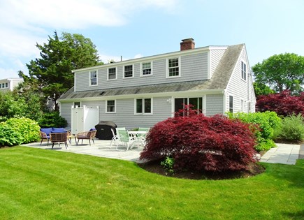 Falmouth Cape Cod vacation rental - Back of house showing patio and outdoor shower