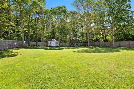 Hyannis Cape Cod vacation rental - Expansive fenced Yard - swing-slide set & firepit