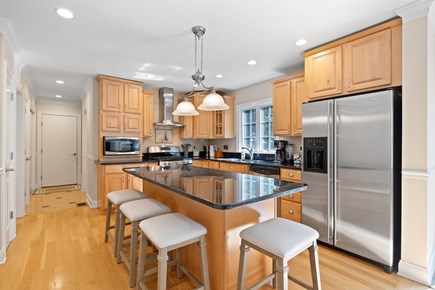 Hyannis Cape Cod vacation rental - Main house kitchen: Gas stove, microwave, dishwasher, fridge.