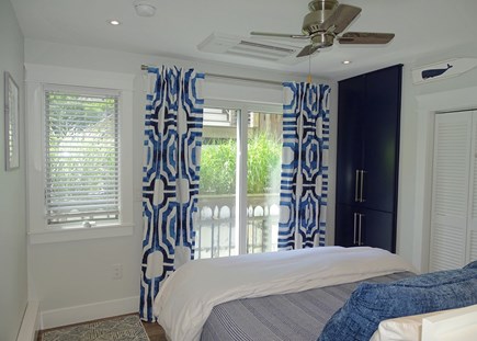 Provincetown West End Cape Cod vacation rental - Bedroom with adjacent bathroom, slider to garden