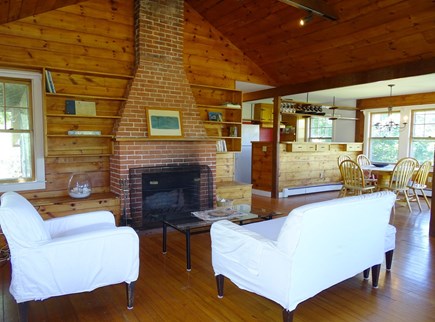 Woods Hole Cape Cod vacation rental - Living room facing fireplace, opens to dining and kitchen