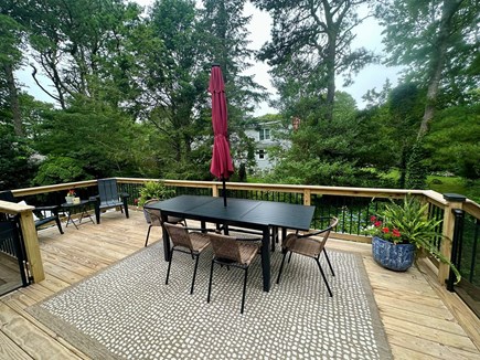 East Dennis Cape Cod vacation rental - Back deck with dining table.  Seating for 6 with umbrella.