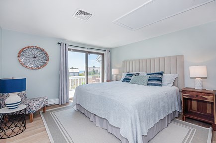 West Yarmouth Cape Cod vacation rental - Primary bedroom with king bed, adjoining bath & door to deck