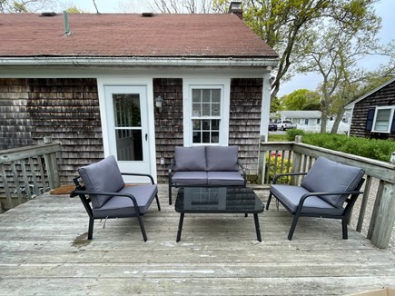 East Falmouth Cape Cod vacation rental - Outside deck with comfy chairs and dining table for 6