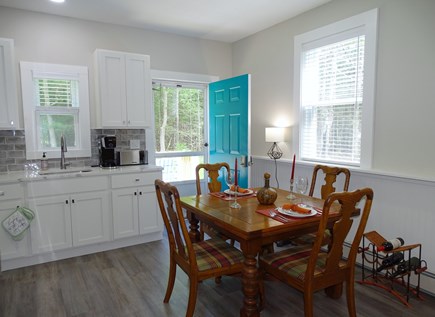 Sandwich (0.9 miles from Snake Cape Cod vacation rental - Dining area with back door to deck and yard