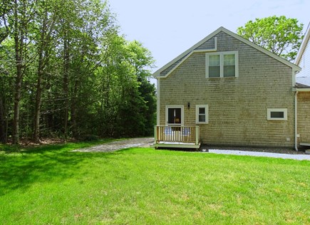 Sandwich (0.9 miles from Snake Cape Cod vacation rental - Deck off kitchen with chairs facing large yard