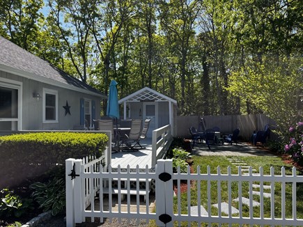 South Yarmouth Cape Cod vacation rental - Backyard lounge room firepit area