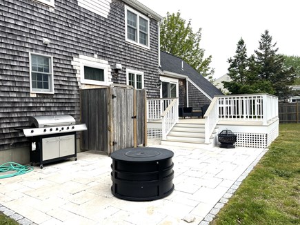 Harwich Port Cape Cod vacation rental - Spacious deck and patio with fire pit, grille, and outside shower