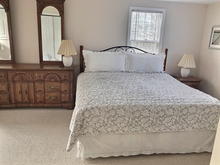 East Orleans Cape Cod vacation rental - Primary bedroom with king bed and en suite access to bathroom