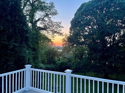 East Orleans Cape Cod vacation rental - Sunset view with peeks of Meetinghouse Pond from back deck