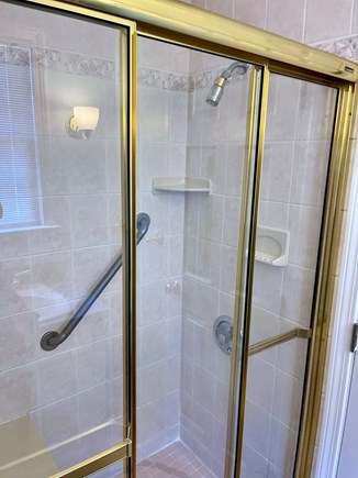 East Orleans Cape Cod vacation rental - Shower in downstairs full bath has grab bar and bench seat