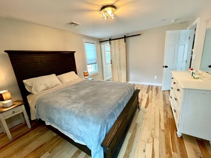 Dennis Cape Cod vacation rental - Primary bedroom with en suite bathroom. Queen sized bed.