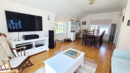 Eastham Cape Cod vacation rental - Family room with dining table, sofa and large flat screen TV