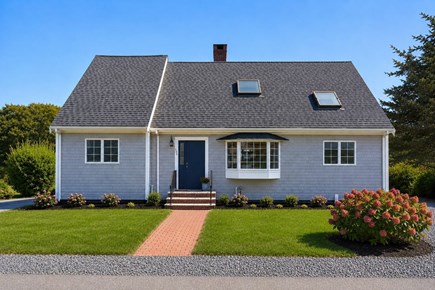 Bourne, Mashnee Island Cape Cod vacation rental - Front of house, new plantings.  Parking or 5 cars<br/>