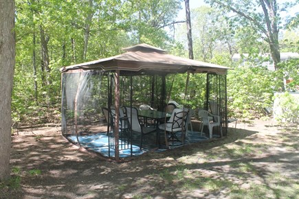 Eastham, Thumpertown - 3992 Cape Cod vacation rental - Screened canopy with outdoor eating area