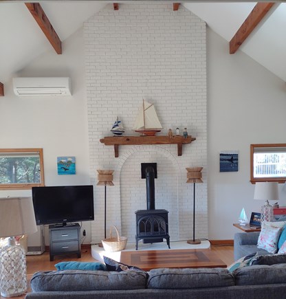 Wellfleet Cape Cod vacation rental - High ceiling living room with a/c mini split. Slider to deck.