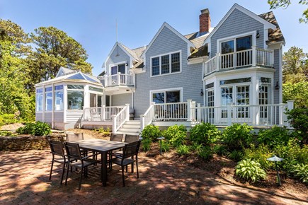 South Dennis Cape Cod vacation rental - Shady back patio with views of the water