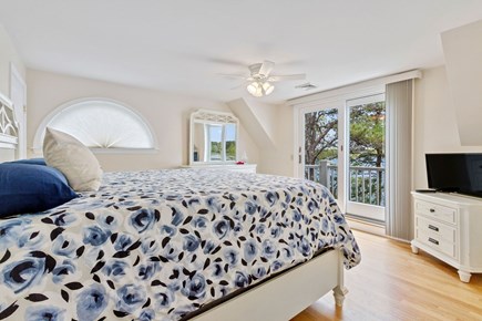 South Dennis Cape Cod vacation rental - Master bedroom with king, en-suite bathroom, Juliette balcony, w