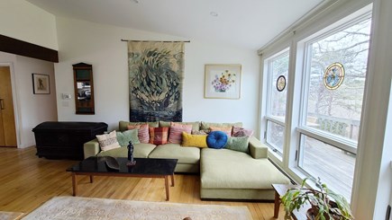 Wellfleet Cape Cod vacation rental - Living room with comfortable seating and door to deck