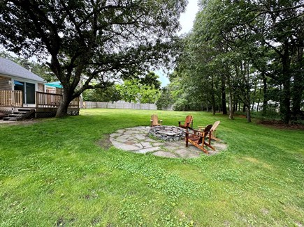 Eastham Cape Cod vacation rental - Fire pit and fenced-in back yard