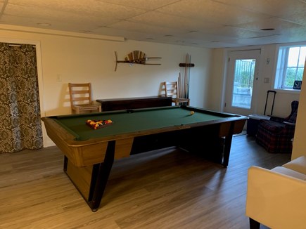 Hyannisport Cape Cod vacation rental - Pool table on lower level and door to backyard and outdoor shower