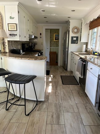 Hyannisport Cape Cod vacation rental - Well-stocked kitchen with granite counters and wine refrigerator