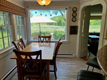 Hyannisport Cape Cod vacation rental - Dining area overlooking patio and creek