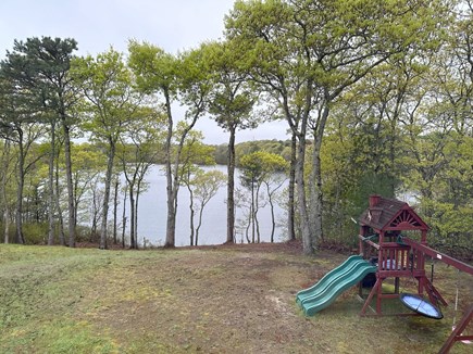 Bourne, Buzzards Bay  Cape Cod vacation rental - View of the backyard and swing set available for play.