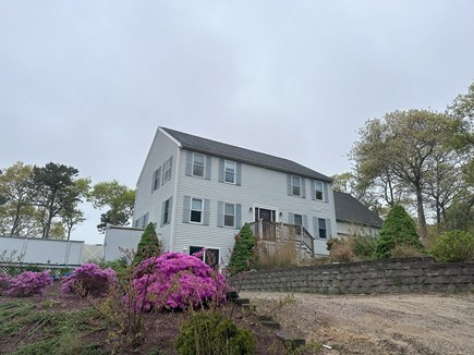 Bourne, Buzzards Bay  Cape Cod vacation rental - The house and pool is on the left, outdoor shower, 2 car garage.