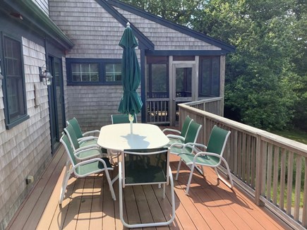 Brewster Cape Cod vacation rental - Al fresco dining with screened in porch in background