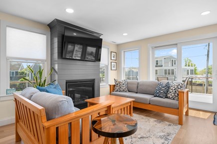 Chatham Cape Cod vacation rental - Gather around the fireplace, catch your favorite shows on the flat-screen TV, and take in the views