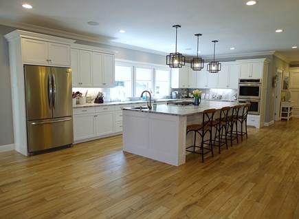 Harwich Cape Cod vacation rental - Large kitchen with breakfast bar seating and new appliances