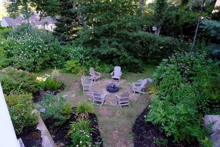 Cotuit, Barnstable Cape Cod vacation rental - Lower yard w/ fire pit and Adirondacks