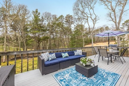 Brewster Cape Cod vacation rental - Back deck with Cape Cod National Golf course behind the trees