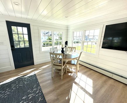 Sandwich, Town Neck Beach Cape Cod vacation rental - Dining area with mounted smart flatscreen TV.