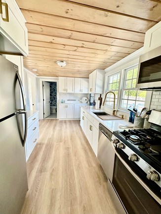 Sandwich, Town Neck Beach Cape Cod vacation rental - Kitchen with gas range, fridge, dishwasher and quartz countertops