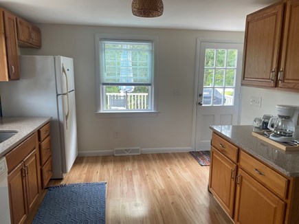 Harwich Cape Cod vacation rental - Kitchen leading out to the deck